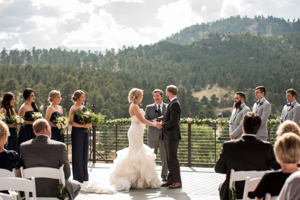 A young couple exchange vows atop the Skyview rooftop, one of Colorado's finest outdoor wedding venues.