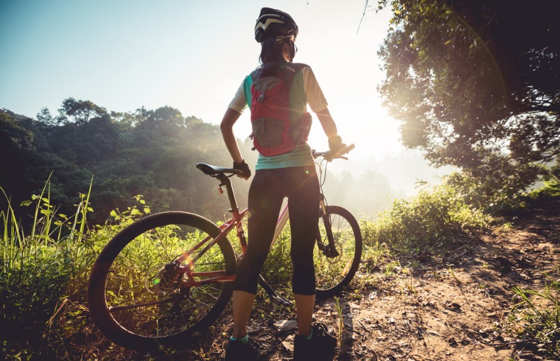 An avid adventurer looks onward as she ponders Colorado mountain biking.