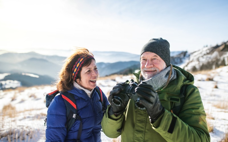 Romantic Getaway Estes Park: A senior couple enjoys the alpine view at Rocky Mountain National Park near Estes Park, CO.